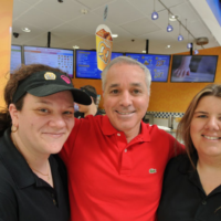 Planet Smoothie Franchise employees with owner