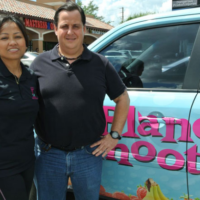Planet Smoothie Franchise employees in front of Planet Smoothie car