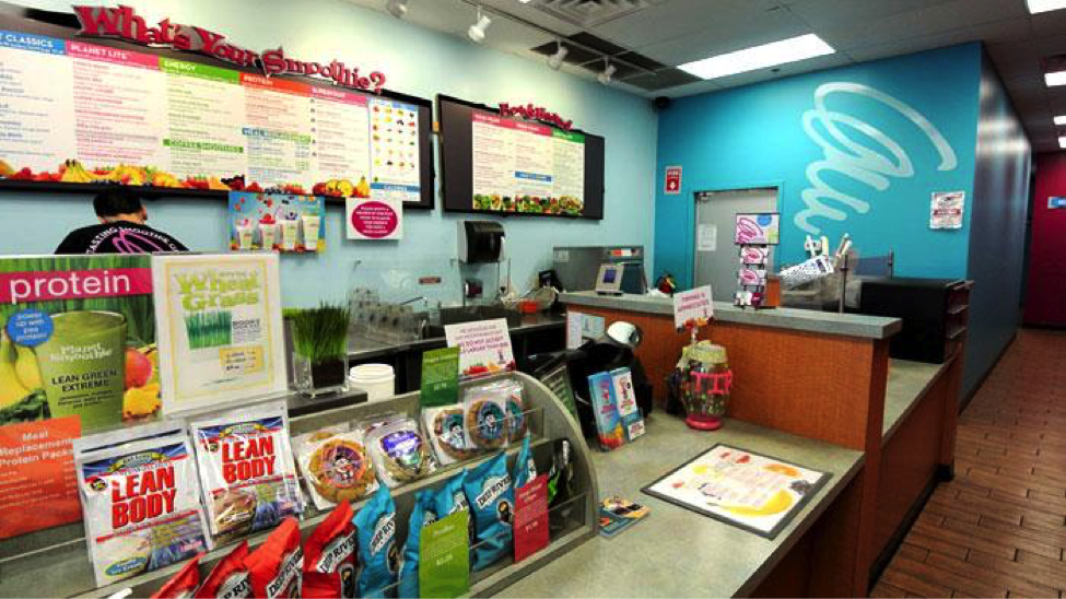 The Clean Well lit interior of a planet smoothie / grow market share
