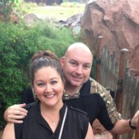 planet smoothie franchise owners smiling together as they hike