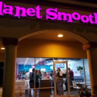 smoothie opening outside door , customers are shown inside