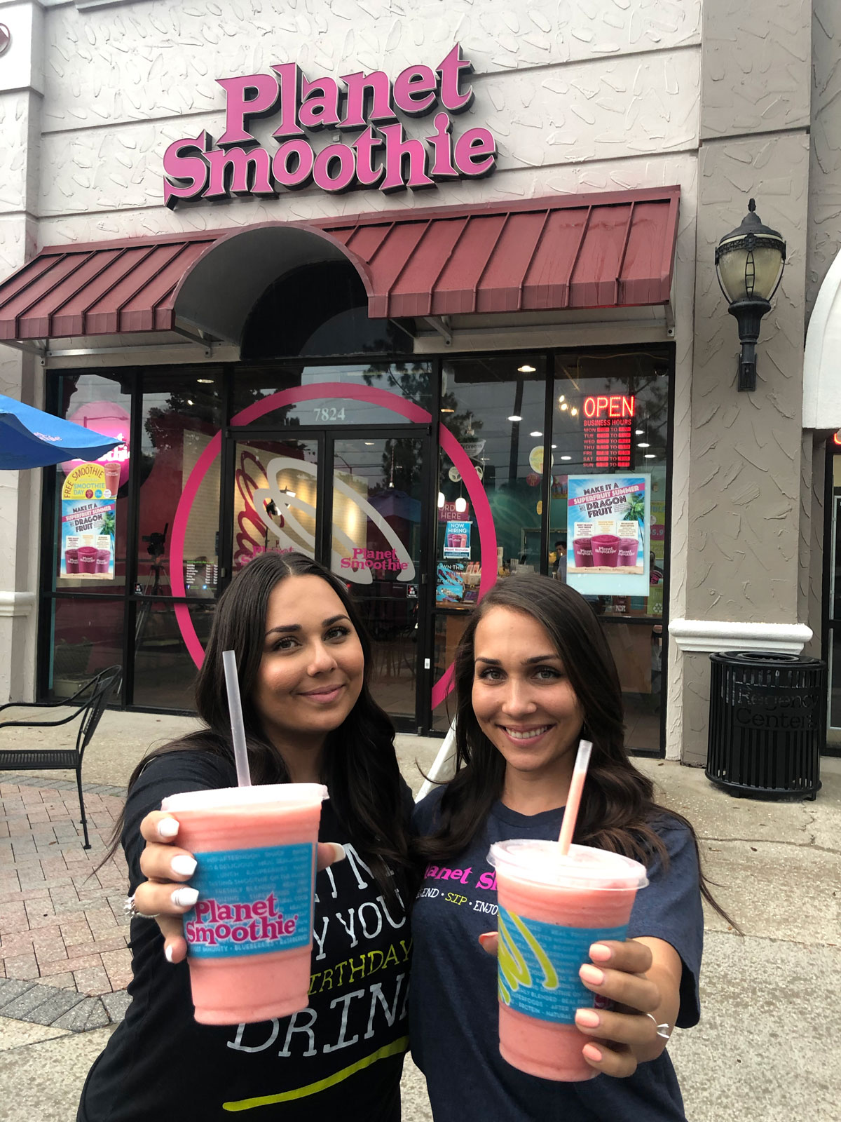 young entrepreneurs two women holding smoothies